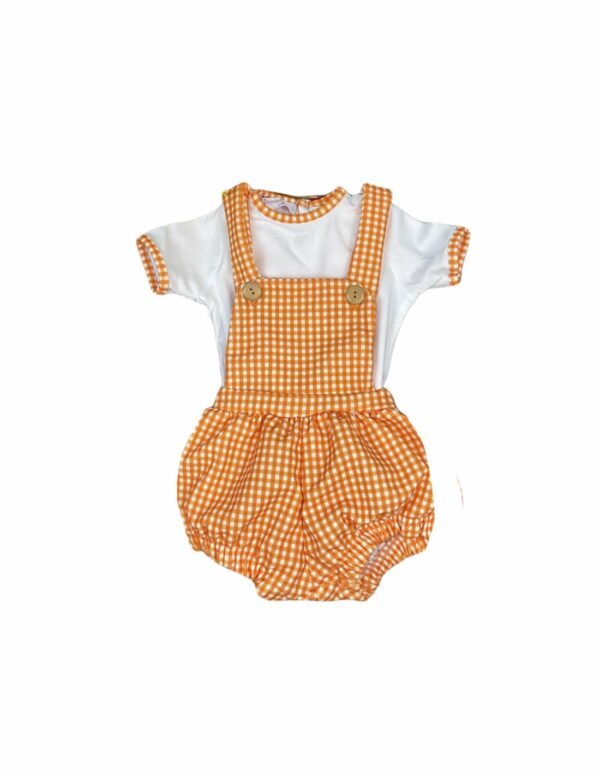 Balloon style baby bib style romper with a orange and white checkered print with suspenders and a white top with orange checkerd trim on the short sleeves and neck line on a white background.
