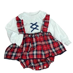 Baby girls white long sleeve blouse with a ruffled collar and wrists criss cross black ribbon design on the chest with a red, black and white gingham print overall ruffled dress on a white back ground.