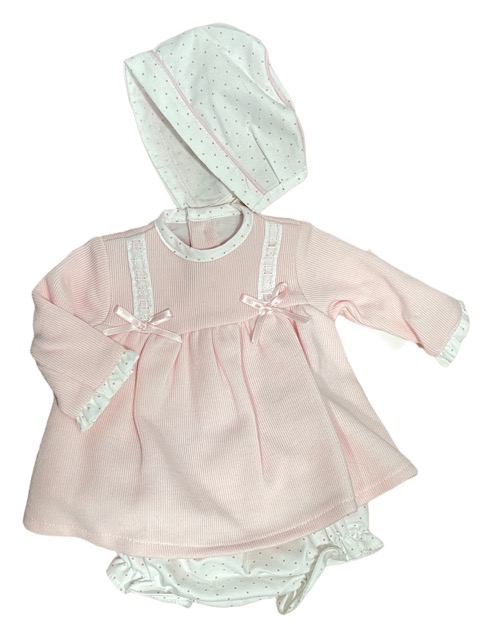 Long sleeved pink dress with polka dot trim on wrists neckline, bloomers and bonnet. lace trim with pink satin ribbons and bows on a white back ground