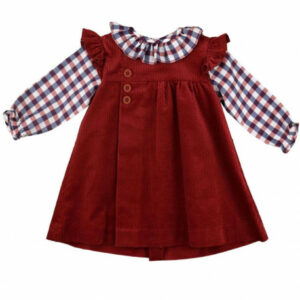 Rich red corduroy dress with a ruffled collar and a long sleeved checkered blouse with a ruffled collar on a white background