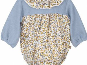 Combined long sleeved light blue fabric with a multi flower print romper with a ruffled collar on a white background.