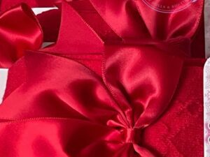 Large burgundy red satin bow decoration on red knit high socks