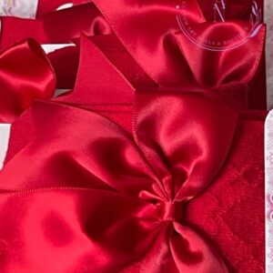 Large burgundy red satin bow decoration on red knit high socks