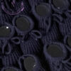 A collage of navy blue knitted baby booties