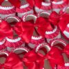 A collage of spanish styled Red and white ruffled soft baby shoes with large satin bows