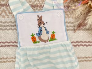 This adorable baby romper has a cute bunny and carrot design embroidered on the bib of these baby blue and white striped overalls. The attached bubble has sweet gathered legs. 95% COTTON 5% SPANDEX Size 3m, 6m Sold by Alz's Baby Boutique