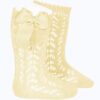 These are absolutely lovely openwork knee-high baby socks with an adorable large side bow. Perfect for baby to wear especially in spring-summer season. Comes in multiple colors. Size- Newborn 100 % cotton  Made in Spain Sold by Alz's Baby Boutique