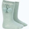 These are absolutely adorable perle baby knee-high socks. Having the cutest pom pom side tassels in a mist green color. Perfect for spring and summer for any attire. Newborn in size 100% cotton Made in Spain Sold by Alz's Baby Boutique