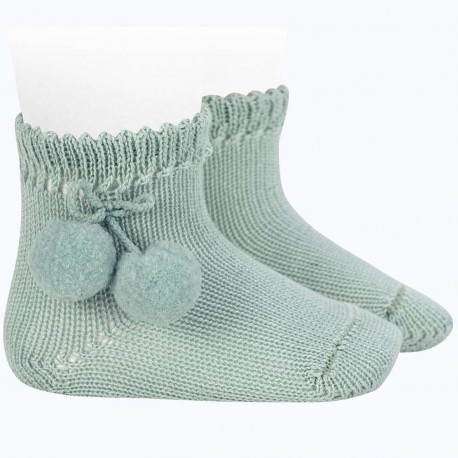 New adorable baby ankle socks in a warm cotton perle with pompoms on the sides. Comes in a variety of colors. 100% cotton Newborn in size Made in Spain Sold by Alz's Baby Boutique