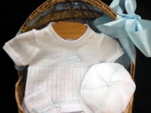 This beautiful baby boys four piece set has the most adorable short sleeve knitted top, bloomers and cap. finishing the look with matching booties trimmed with a delicate blue satin bow and the cutest embroidered airplane. Size- preemie   Sold by Alz's Baby Boutique