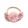 Baby girls newborn photography floral nylon headband sold by Alz's Nursery