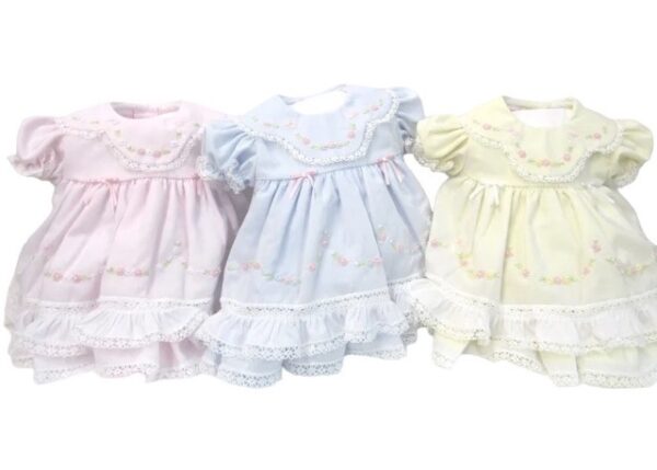 This sweet baby girls heirloom set is absolutely stunning with tons of hand embroidered flowers set with the daintiest pearls, tons of the prettiest lace ruffles. This tiny little dress has a beautiful scalloped collar with gathered balloon short sleeves. Only one left in baby blue. Size- Preemie Sold by Alz's Baby Boutique