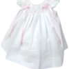 Another stunning angel sleeve bishop dress. This little beauty has intricate embroidered detail flowers on smocking with two satin bows accents with pearls. Rows of pleated tucks goes all around this sweet dress. This little dress has adorable ruffled capped short sleeves. Includes a detachable lined slip. 65% polyester 35% cotton  Made in Columbia Size- Newborn Sold by Alz's Baby Boutique