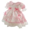 This absolutely beautiful vintage style baby apron dress has so many details! Featuring a peter style collar, trimmed with the most delicate scalloped lace. A double lining with eyelet ruffles throughout. Gathered puffed short sleeves, satin woven ribbons and bows with a button closure back and large tie bow.  Comes in Blue or Pink Size- 80cm (equivalent to 6-12m US) Sold by Alz's Baby Boutique