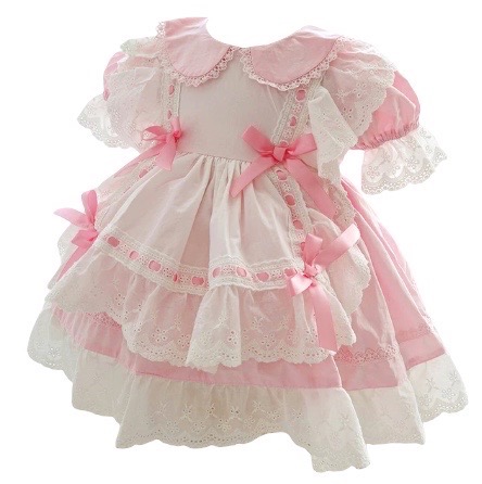 This absolutely beautiful vintage style baby apron dress has so many details! Featuring a peter style collar, trimmed with the most delicate scalloped lace. A double lining with eyelet ruffles throughout. Gathered puffed short sleeves, satin woven ribbons and bows with a button closure back and large tie bow.  Comes in Blue or Pink Size- 80cm (equivalent to 6-12m US) Sold by Alz's Baby Boutique