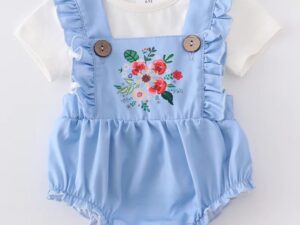 This is such an adorable two piece blue ruffled romper set. The top being a classic versatile white blouse with short sleeves. The Balloon overalls have the cutest floral applique in colors of red, peach, green and white. 97% Cotton  3% Spandex Size 6m, 12m Sold by Alz's Baby Boutique