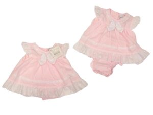 This tiny baby's dress has a beautiful soft pink color with white short ruffled capped sleeves and trim, intricate scalloped design details throughout, a sweet bow with a button closure back and matching bloomers. Such an adorable preemie set. 65% polyester 35% woven cotton Made in the UK Size 3-5lbs, 5-8lbs Sold by Alz's baby Boutique.