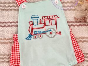An adorable sage green baby bubble romper with the sweetest embroidered train, red and white checkered printed material used for accenting this outfit is so cute. 95% COTTON 5% SPANDEX Size 3m Sold by Alz's Baby Boutique