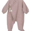 This little sleeper has a simple neutral design with a tie wrap closure. These sweet pajamas are simply perfect for snuggling your newborn. Available in rose, tan, coco or denim blue. 100% cotton Made in Spain Size- Newborn   Sold by Alz's Baby Boutique