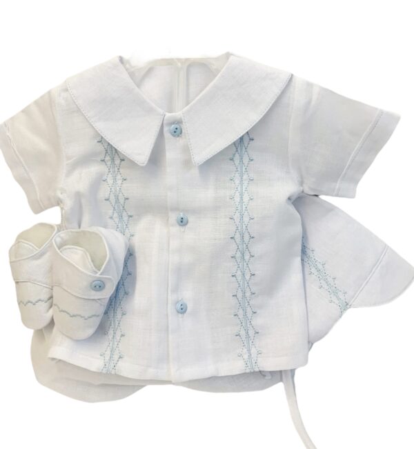 This adorable heirloom quality baby boys set comes with the cutest beret, blouse, bloomers and soft shoes. The knit features gorgeous blue embroidery  on soft white. The top has has short sleeves,the cutest buttons and a puritan collar. Made in Columbia Sold by Alz's Baby Boutique