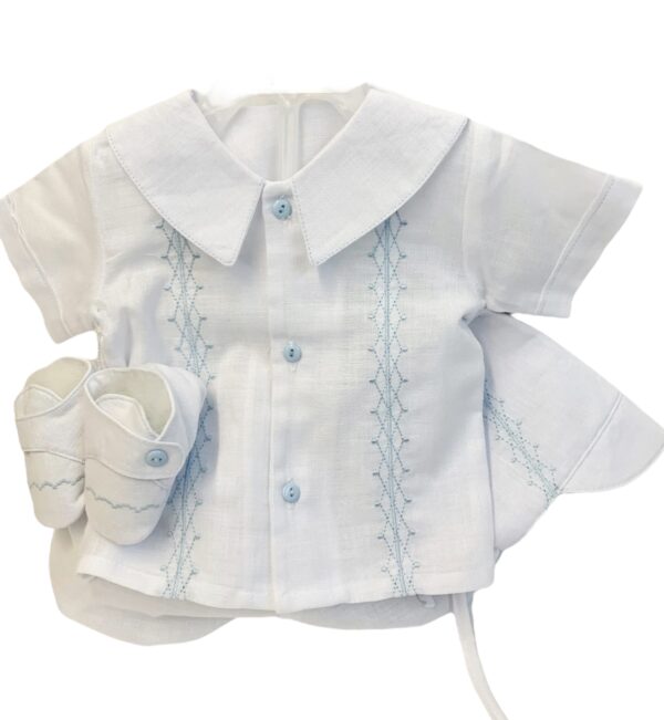 This adorable heirloom quality baby boys set comes with the cutest beret, blouse, bloomers and soft shoes. The knit features gorgeous blue embroidery  on soft white. The top has has short sleeves,the cutest buttons and a puritan collar. Made in Columbia Sold by Alz's Baby Boutique