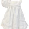 Delicate heirloom dress has layers of delicate lace trim, with beautiful embroidered flowers and tiny pearl accent. Has rows of pleated details around the entire dress. Buttons and ties at the back with sash bow. Made in Columbia Poly cotton blend Sold by Alz's Baby Boutique