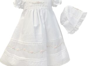 An absolutely beautiful baby gown with delicate embroidered flowers over rows of organza detail, lace inset with delicate lace border trim, has rows of tiny pleated design. Gathered puffed short sleeves trimmed with lace. Fully lined. Includes a matching bonnet. Made in Columbia Poly cotton blend.  Sold by Alz's Baby Boutique